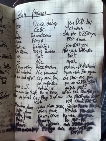 Handwritten Polish phrases and phonetic spellings in a notebook