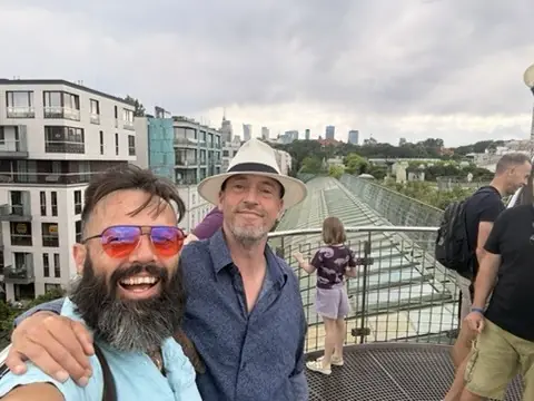 Gavin filming by the river in Prague