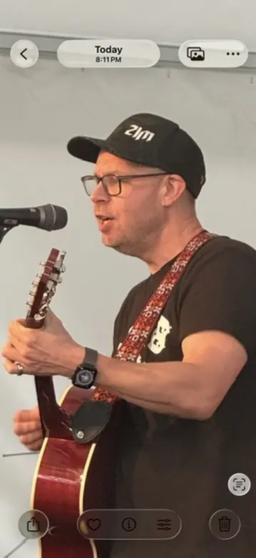 Shadrach playing guitar at the Bitcoin conference