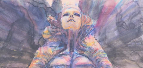 A central figure surrounded by a radiating colorful headdress