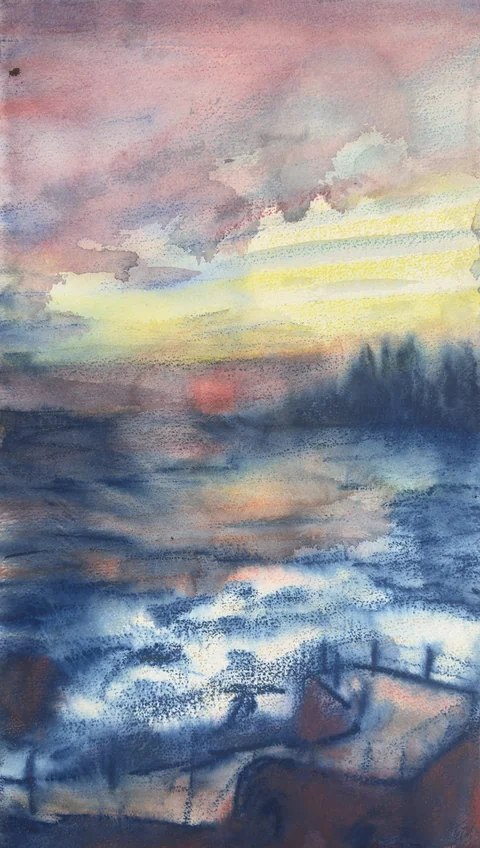 A sunset over ocean water and a terrace railing
