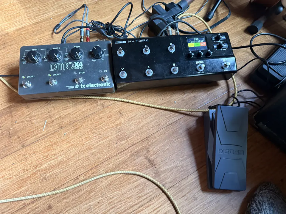 My pedalboard on the studio floor: TC Electronic Ditto X4 looper, Line 6 HX Stomp XL showing the 01D TJ Aurora Pad preset, and a Boss EV-30 expression pedal