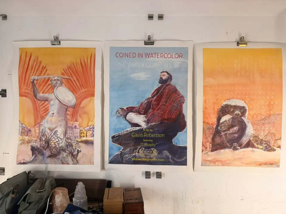 The three paintings made for Bitcoin Film Festival hanging together: Warsaw Syrenka, Coined in Watercolor, and the honey badger with cub.