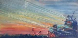 A festival stage sending laser beams across a sunset sky