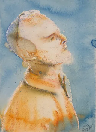 A man with close-cropped hair looking upward