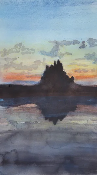 A tall tree silhouette reflected in water at dawn