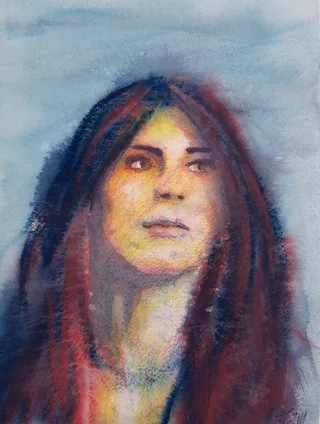 A woman with long dark hair looking upward against a blue background