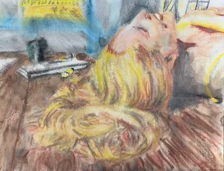A reclining person with long blond hair beside a window