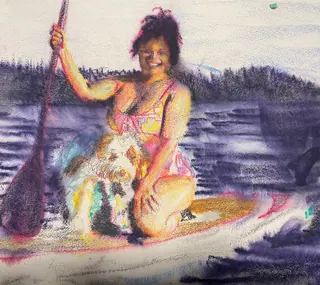 Laura and Cafécito on paddleboard in Lake Washington